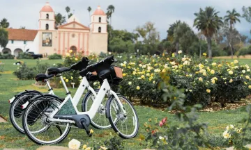 Two electric-assist bicycles at the Rose Garden at the Santa Barbara Mission. 