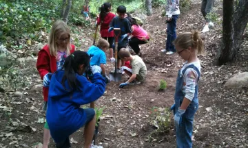 Students from Peabody Charter School install native plants at Oak Park
