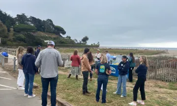 People gathering Creek Week at Andree Clark Bird Refuge