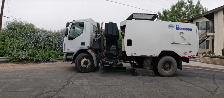 street sweeper vehicle on a residential road