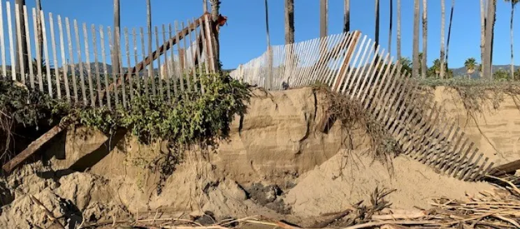 Damaged fence along East Beach due to erosion