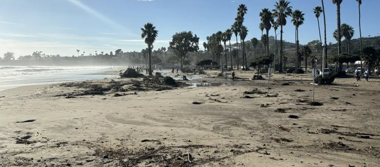 Parking lot for Leadbetter Beach and the Harbor covered in sand in December 2023