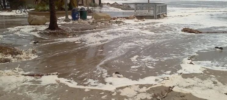 Leadbetter Beach, parking lot, and facilities covered in sand and water during March 2014 wave event