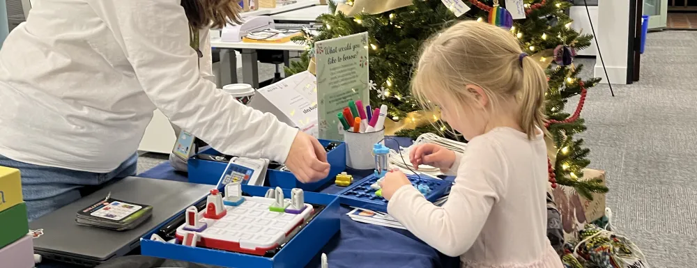 A child explores Library of Things items