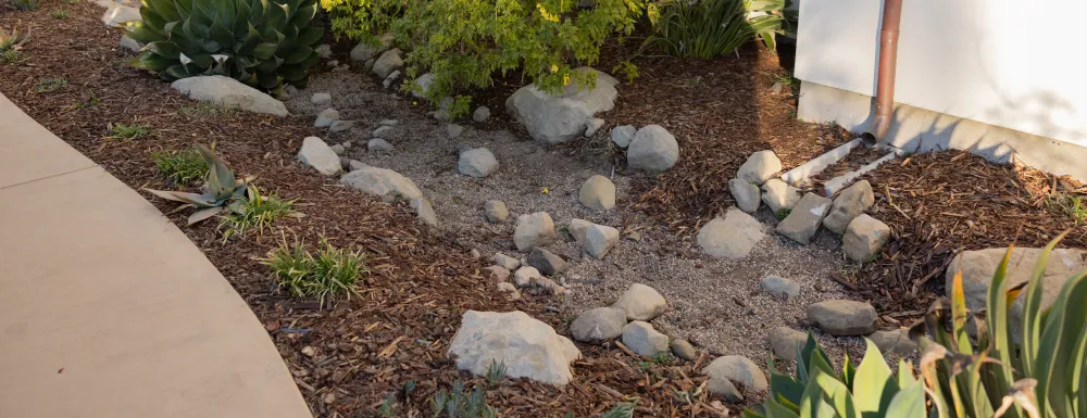 Storm water BMP at the Sandman Inn showing a downspout directed into landscaped area