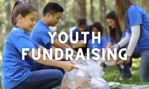 Image of youth cleaning up trash in a park