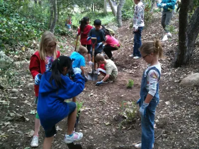 Students from Peabody Charter School install native plants at Oak Park