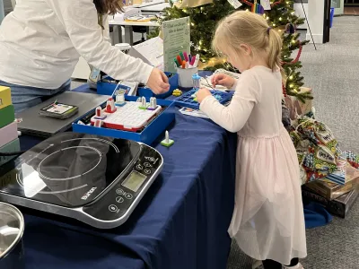 A child explores Library of Things items