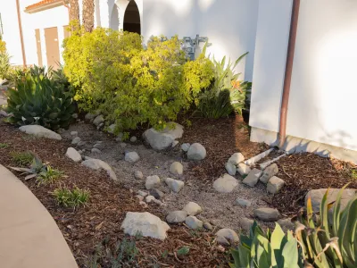 Storm water BMP at the Sandman Inn showing a downspout directed into landscaped area